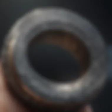 Close-up of intricate engravings on Nathan Drake's ring